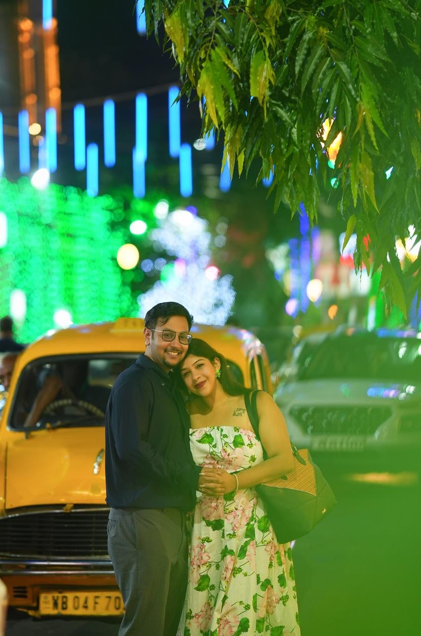 Soham and Tania together beneath the lights of a Kolkata evening
